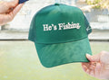 He's Fishing Trucker Hat